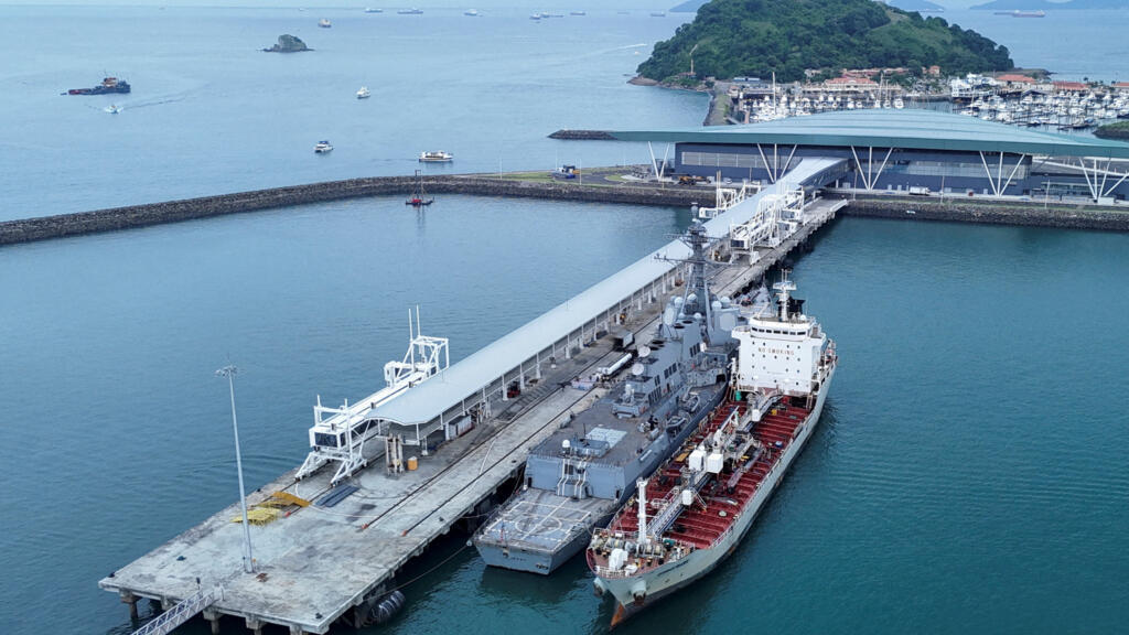 The U.S. Navy guided missile destroyer USS Sampson DDG-102 docked near the entrance to the Panama Canal